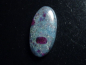 Preview: Rubin in Kyanit / Disthen 37,38 Ct. Oval Cabochon