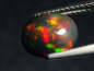 Preview: Schwarzer Opal 1,47 Ct. behandelt - 9 x 7 mm Oval Cabochon