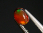 Preview: Feueropal 0,64 Ct. mit Farbenspiel Oval Cabochon