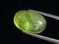 Preview: Peridot 9,47 Ct. applegreen - 14,5 x 9 mm oval cabochon