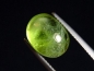 Preview: Peridot 6,51 Ct. applegreen - 12 x 9 mm oval cabochon