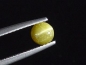 Preview: Chrysoberyl cat's eye 0,68 Ct. round cabochon Sri Lanka