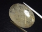 Preview: Rutile Quartz 29,23 Ct. golden Rutile needles oval cabochon