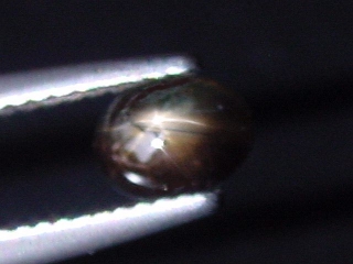 Star Sapphire 0,89 Ct. black golden cabochon