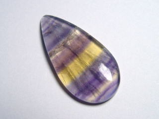 Fluorite 29,86 Ct. multicolor banded cabochon B-quality