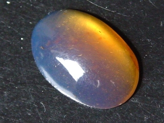Blue Amber 4,17 Ct. - 20,5 mm oval cabochon Jambi, Sumatra