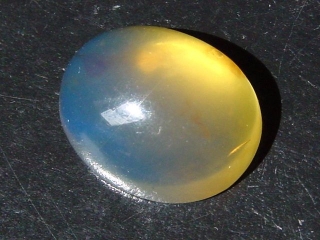 Blue Amber 11,52 Ct. - 21,5 mm oval cabochon Domin. Republic