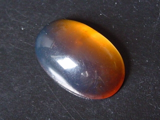 Blue Amber 15,09 Ct. - 28,5 mm oval cabochon Jambi, Sumatra