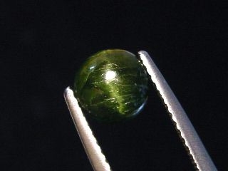 Kornerupine Catseye 1,83 Ct. round cabochon Sri Lanka