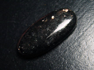 Bronzite 28,77 Ct. oval cabochon with fine shimmer