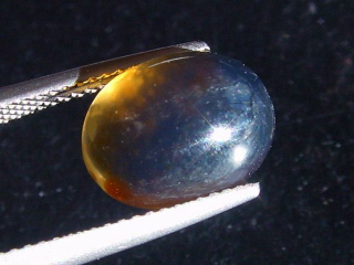 Blauer Bernstein 1,76 Ct. - 11,5 mm Oval Cabochon Indonesien