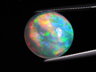 Opal 7,64 Ct. finest quality - round cabochon