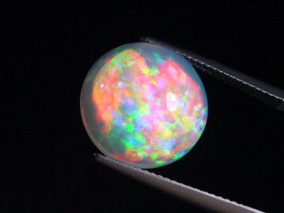 Opal 7,64 Ct. finest quality - round cabochon