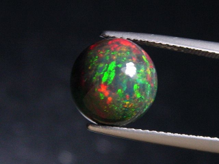 Black Opal 3,32 Ct. treated - round cabochon