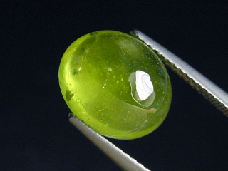 Preview: Peridot 6,58 Ct. - Apfelgrün - 12 x 10 mm Oval Cabochon Preview: Peridot 6,58 Ct. - Apfelgrün - 12 x 10 mm Oval Cabochon