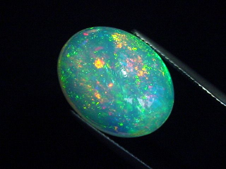 Preview: Opal / Edelopal 11,12 Ct. feinste Qualität - 19 x 15 mm Oval Cabochon Preview: Opal / Edelopal 11,12 Ct. feinste Qualität - 19 x 15 mm Oval Cabochon