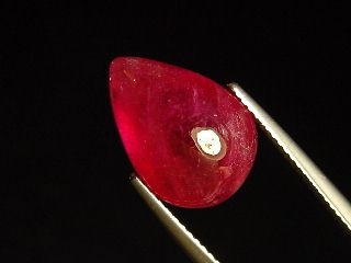 Ruby 11,50 Ct. pear cabochon - fine red - treated