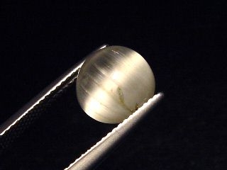 Topaz cat's eye 5,59 Ct. rare round cabochon - Minas Gerais, Brazil