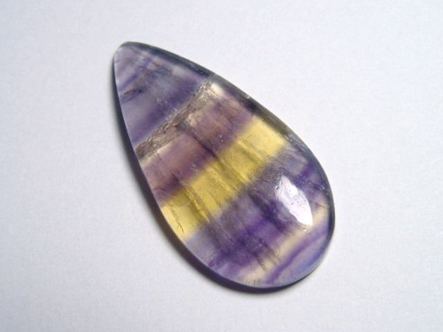 Fluorite 29,86 Ct. multicolor banded cabochon B-quality