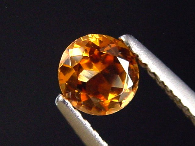 Spessartit Granat 0,59 Ct. leuchtend orange 5 mm Rund Tansania