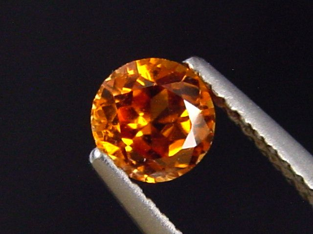 Spessartit Granat 0,66 Ct. leuchtend orange 5 mm Rund Tansania