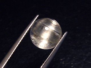 Topaz cat's eye 5,80 Ct. rare round cabochon - Minas Gerais, Brazil