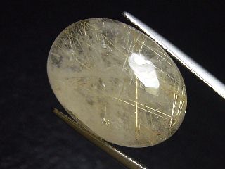 Rutile Quartz 29,23 Ct. golden Rutile needles oval cabochon