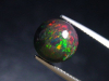 Black Opal 3,32 Ct. treated - round cabochon